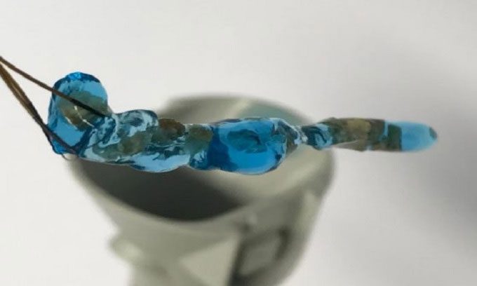 Hydrogel block containing pieces of kidney stones inside.