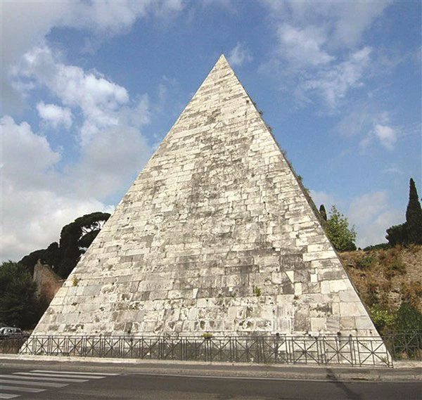 The Pyramid of Cestius with a pointed top unlike the Egyptian pyramid model.