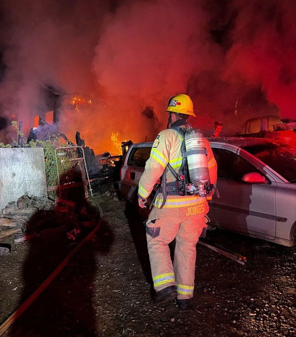 Firefighters arrive at the scene to extinguish the fire