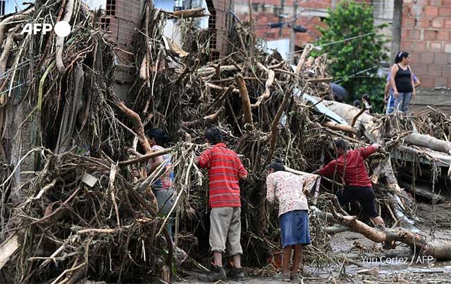 Rescue teams searching for victims under the rubble of houses