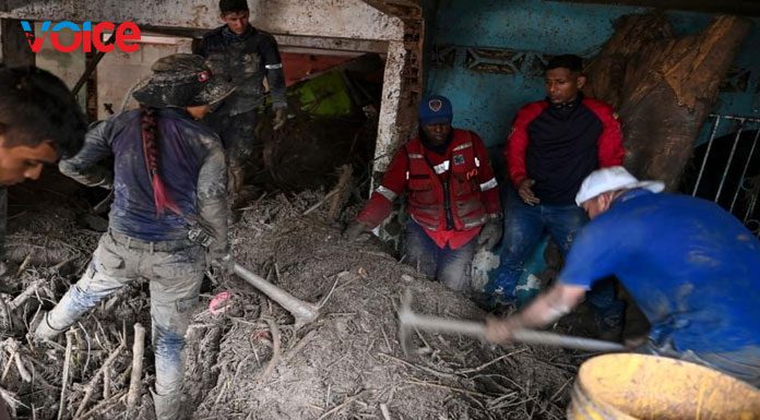 Rescue teams searching for victims under the rubble of houses