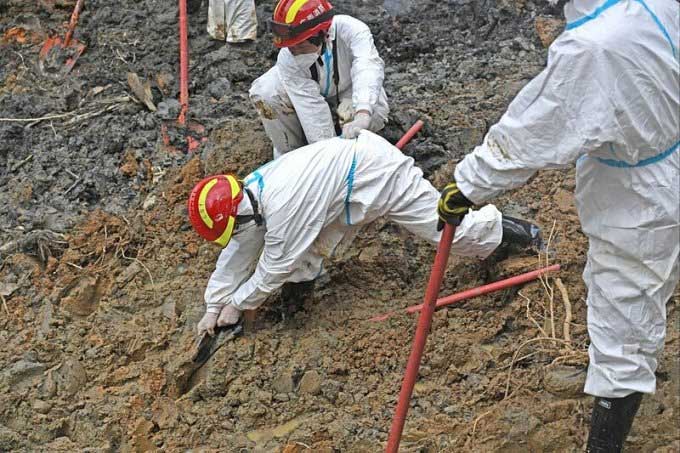 Rescue teams at the plane crash site in Guangxi, China on March 25