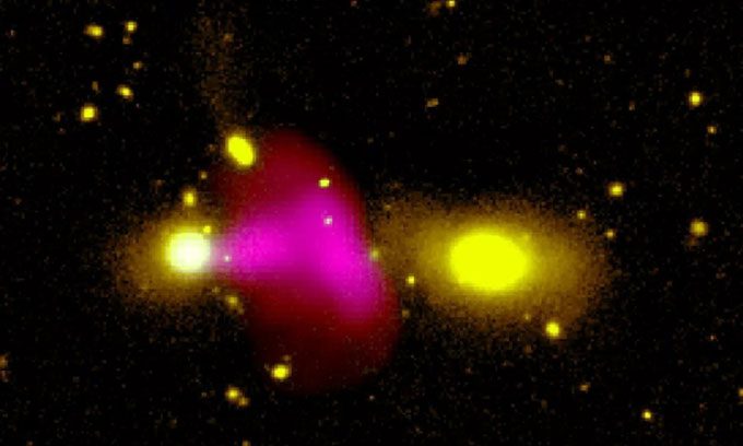 Plasma jet ejected from the center of Galaxy RAD12 attacking Galaxy RAD12-B.