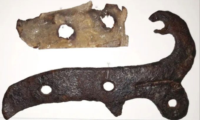 A piece of skin and a hinge from St. Botolph's Church in Hadstock, England.