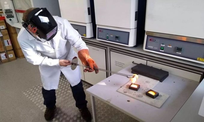 A member of the research team creating a sample of bioactive glass.
