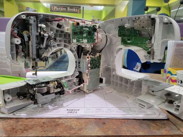 A sewing machine split in half