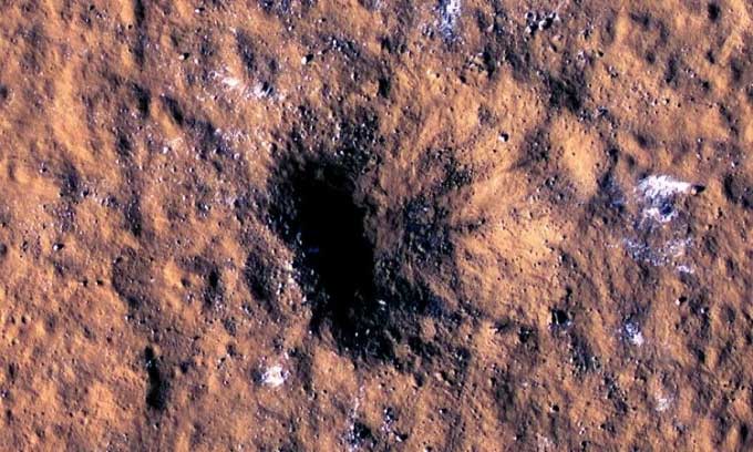 Large boulders scattered around the impact crater.