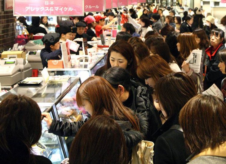 Japanese women shopping for chocolate to give to male colleagues on February 14th.