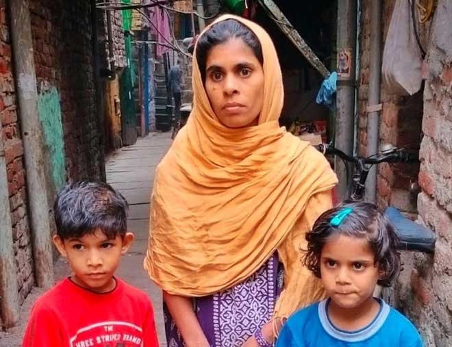 Khatoon with her children outside their home