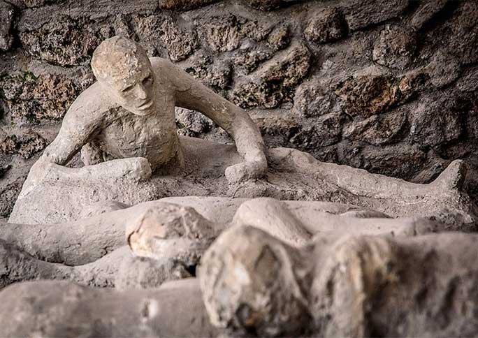 Throughout Pompeii are people like sculptures: They are real individuals, turned to "stone" by volcanic ash