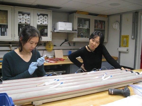 Scientists analyzing seawater samples collected from the oceans around Zealandia.