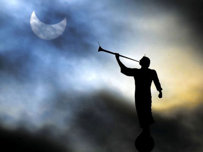 Partial solar eclipse atop a church in Brigham City, Utah, USA