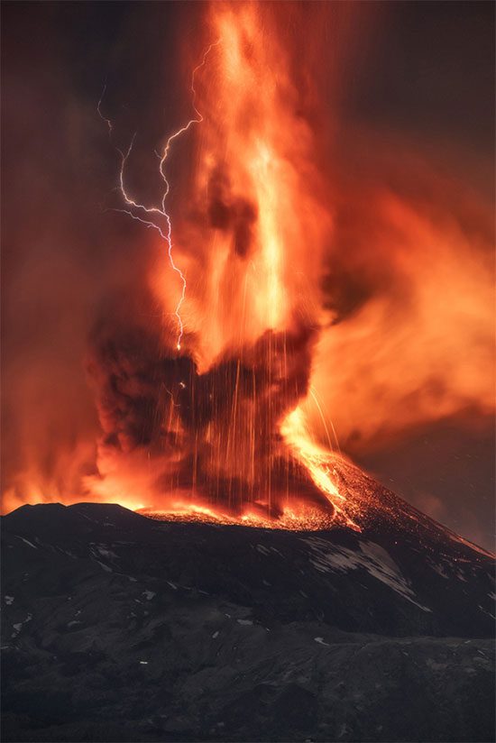 Lightning forms within the ash plume and lava of Etna on February 10