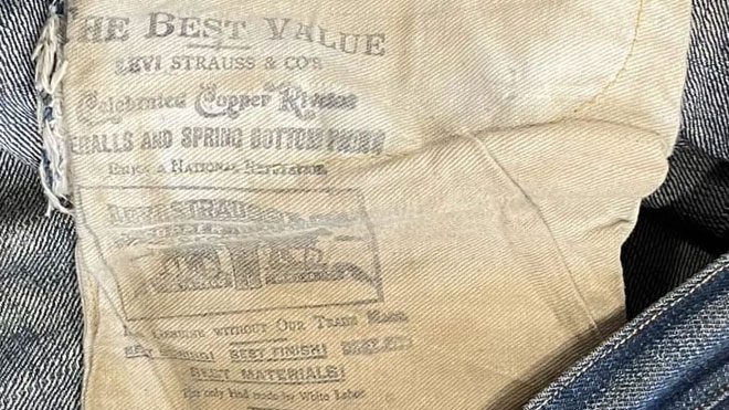 The label inside the jeans reads 'The only type made by white laborers.'
