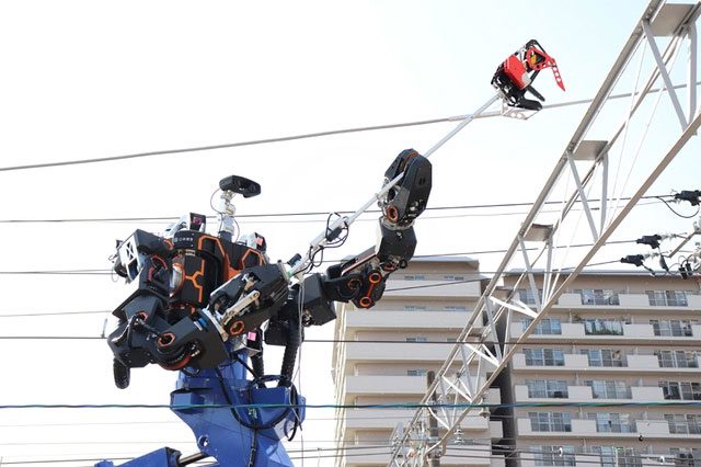 The giant robots are designed to handle overhead components of the railway.