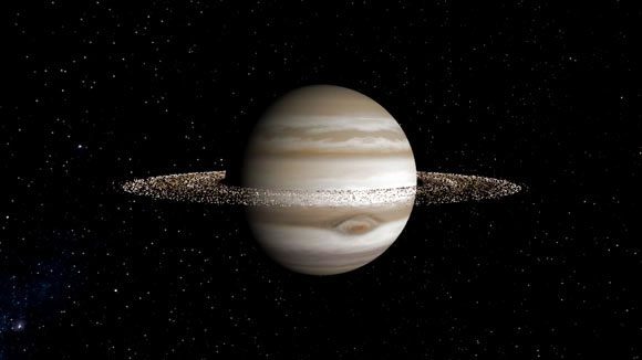 Jupiter, while large, has a significantly more modest ring system.