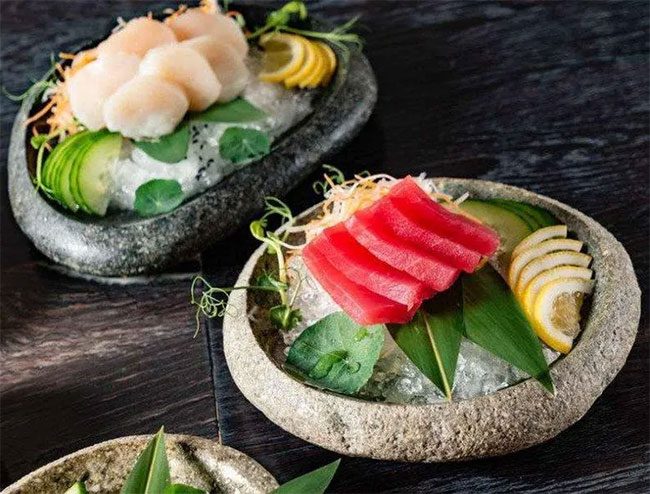 Raw fish dishes like sashimi pose a risk of parasitic infections.