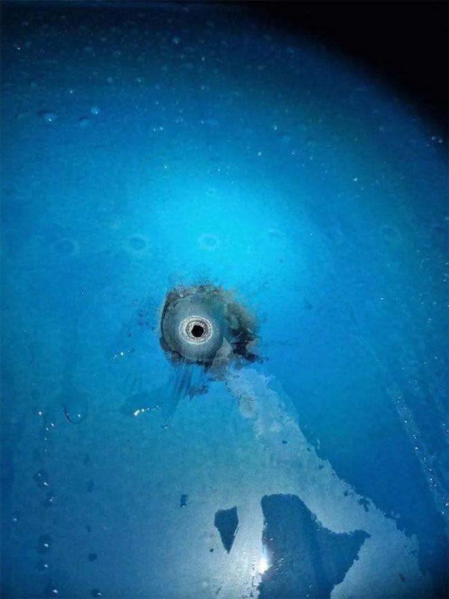 Holes on an airplane from lightning strikes.