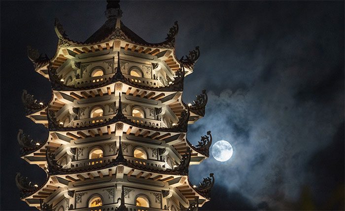 The supermoon next to the stupa at Bang Pagoda (Hoang Mai District, Hanoi) at 9 PM