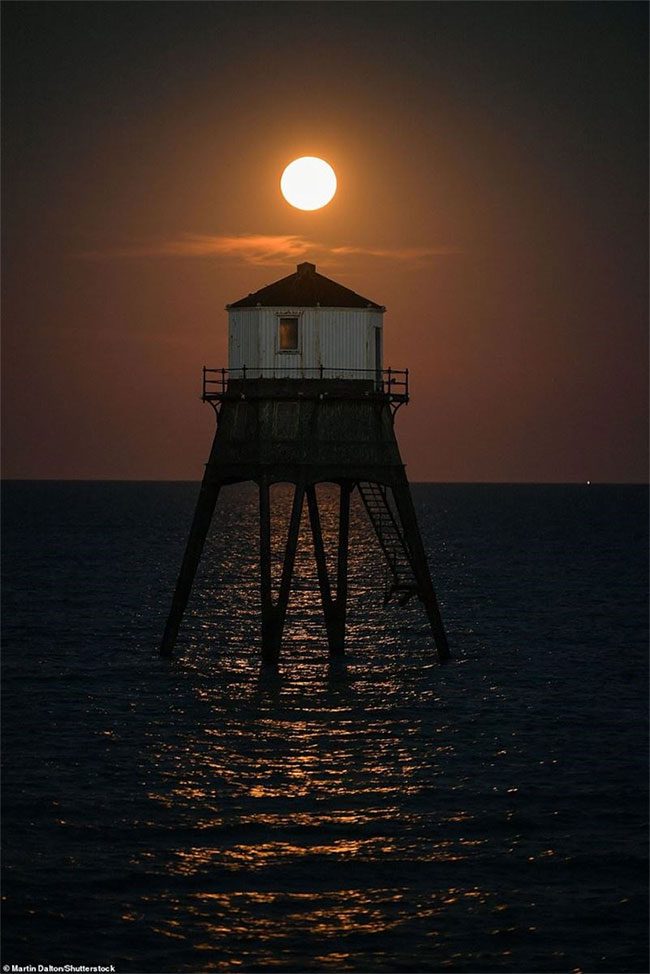 The supermoon illuminating the quiet space around the Dovercourt Lower lighthouse.
