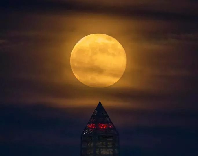 A supermoon rising over the Washington Monument