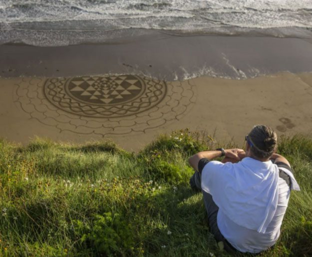 After finishing the painting, Manuel Frolich finds a good spot to view his work.