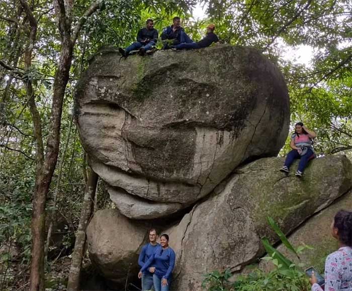 Tourists flock to Miguel Barreto's farm to take photos next to the strange rock.