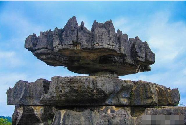 The boulder weighing dozens of tons precariously balanced on a tiny rock in Chongqing.
