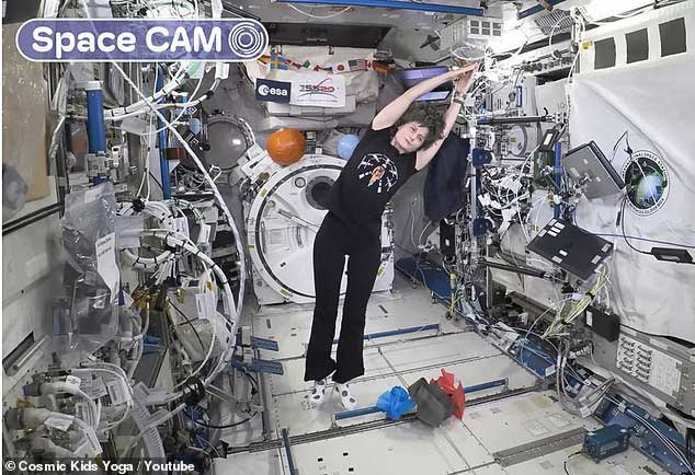 Italian astronaut Samantha Cristoforetti practicing yoga on the International Space Station.