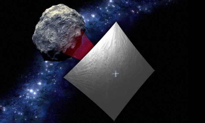 Illustration of the NEA Scout spacecraft with its sail deployed while flying past the target asteroid.