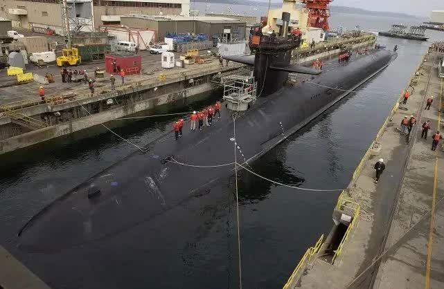 A nuclear submarine at port.