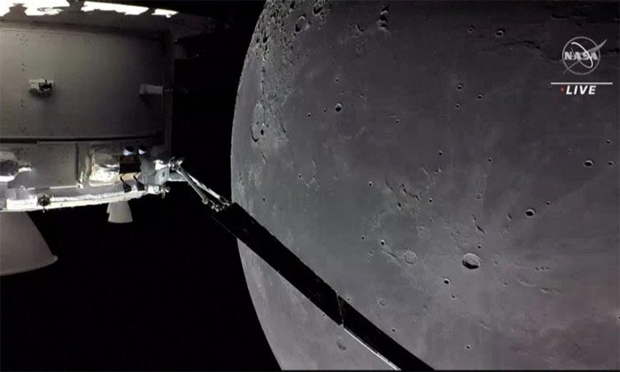 Orion spacecraft captures images of the Moon and Earth (crescent shape) on December 5.