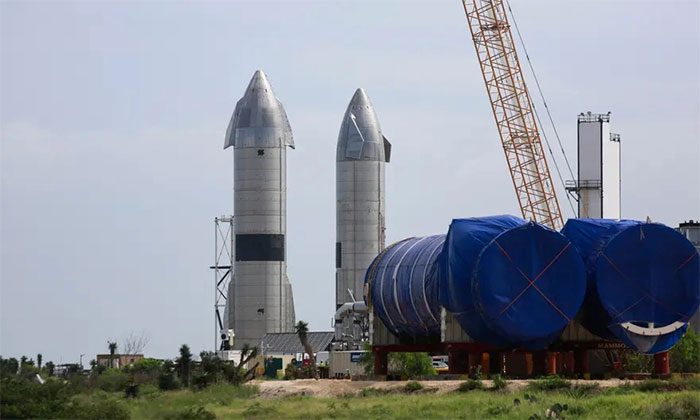 Two SpaceX Starship spacecraft under construction in Texas.