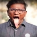 the man with the longest tongue in the world curves it into his nose 119738
