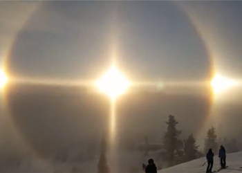 the sun appears on the snowy mountain in switzerland 123840