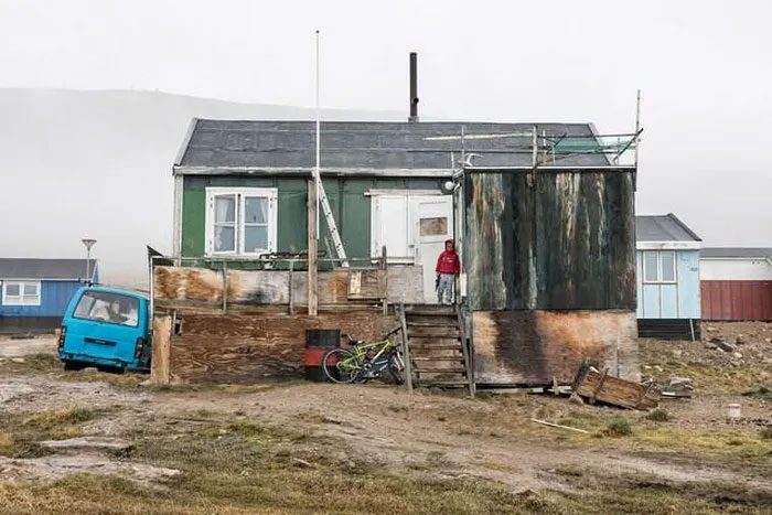 A family living in this sinking, decaying house.