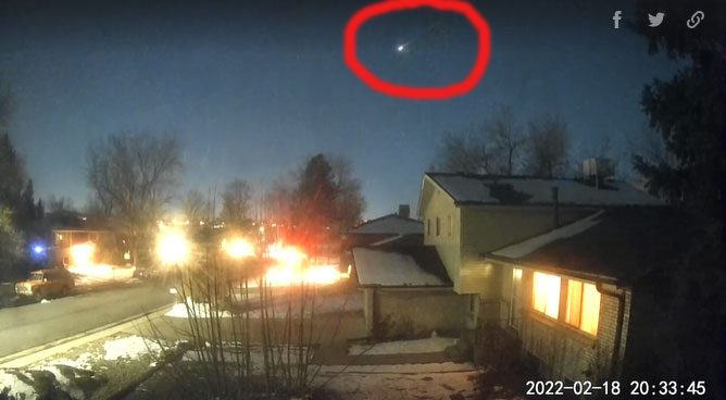 Bright white meteor with burning debris
