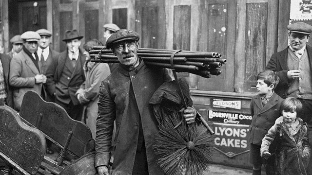 Chimney sweep with his tools.