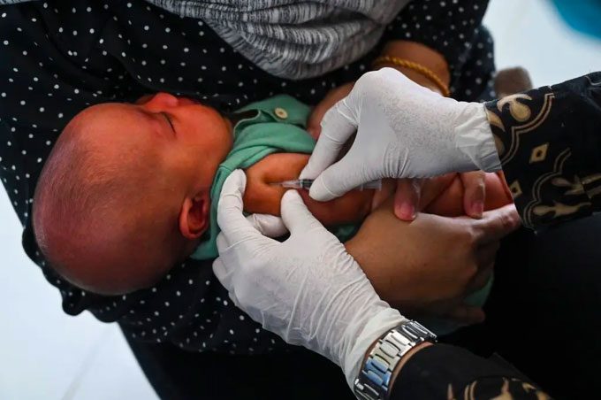 A boy in Banda Aceh, Indonesia, receiving the BCG vaccine against tuberculosis.