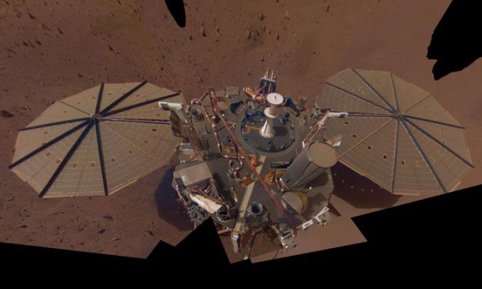 InSight lander selfie taken in early 2019, covered by a thin layer of dust.