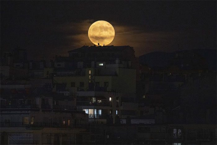 The full moon appears in Marseille, southern France on June 14.