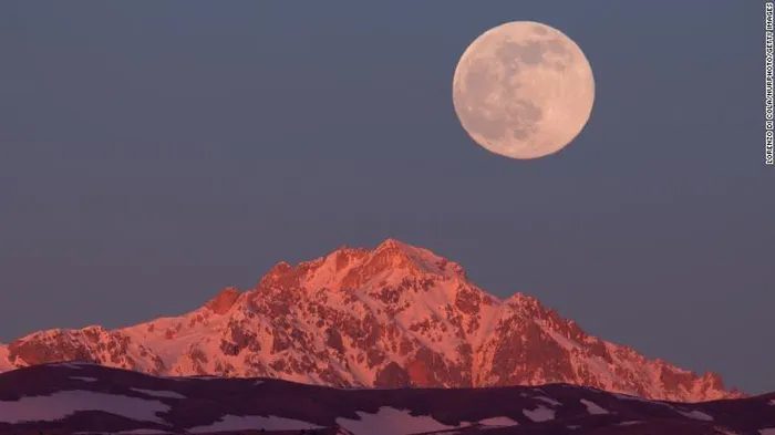 The Wolf Moon setting behind Monte Prena in Gran Sasso d'Italia National Park.