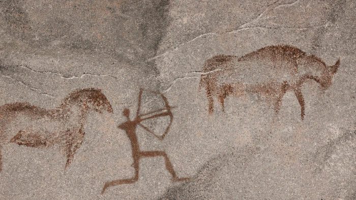 Cave paintings of prehistoric humans.