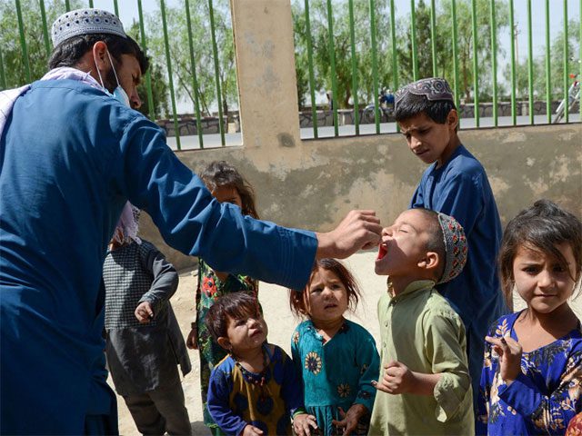 Children in Kandahar, Afghanistan receiving the polio vaccine on May 23.