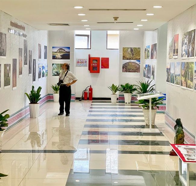 A delighted visitor admiring images of volcanic caves