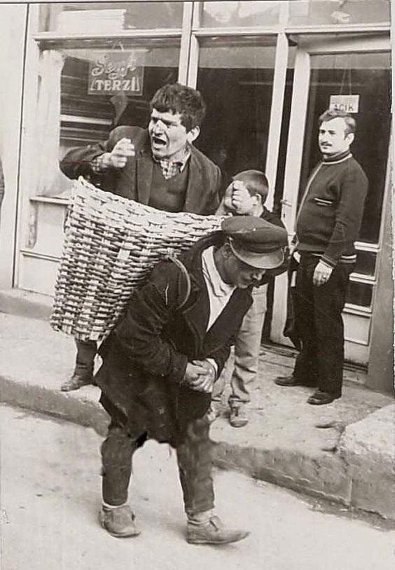 Turkish people bringing drunk patrons home in a basket.