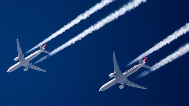 White streaks left by aircraft during flight.