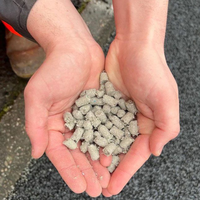 Small gray pieces made from shredded diapers have been added to the asphalt.
