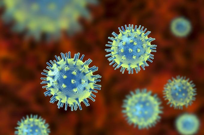 Electron microscopy image of a virus invading a cell.