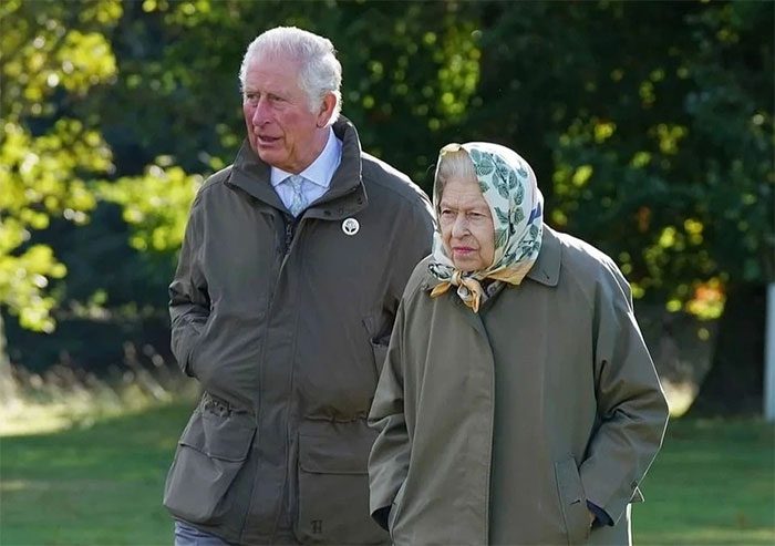 The Queen and Prince Charles walking at Balmoral in October 2021.